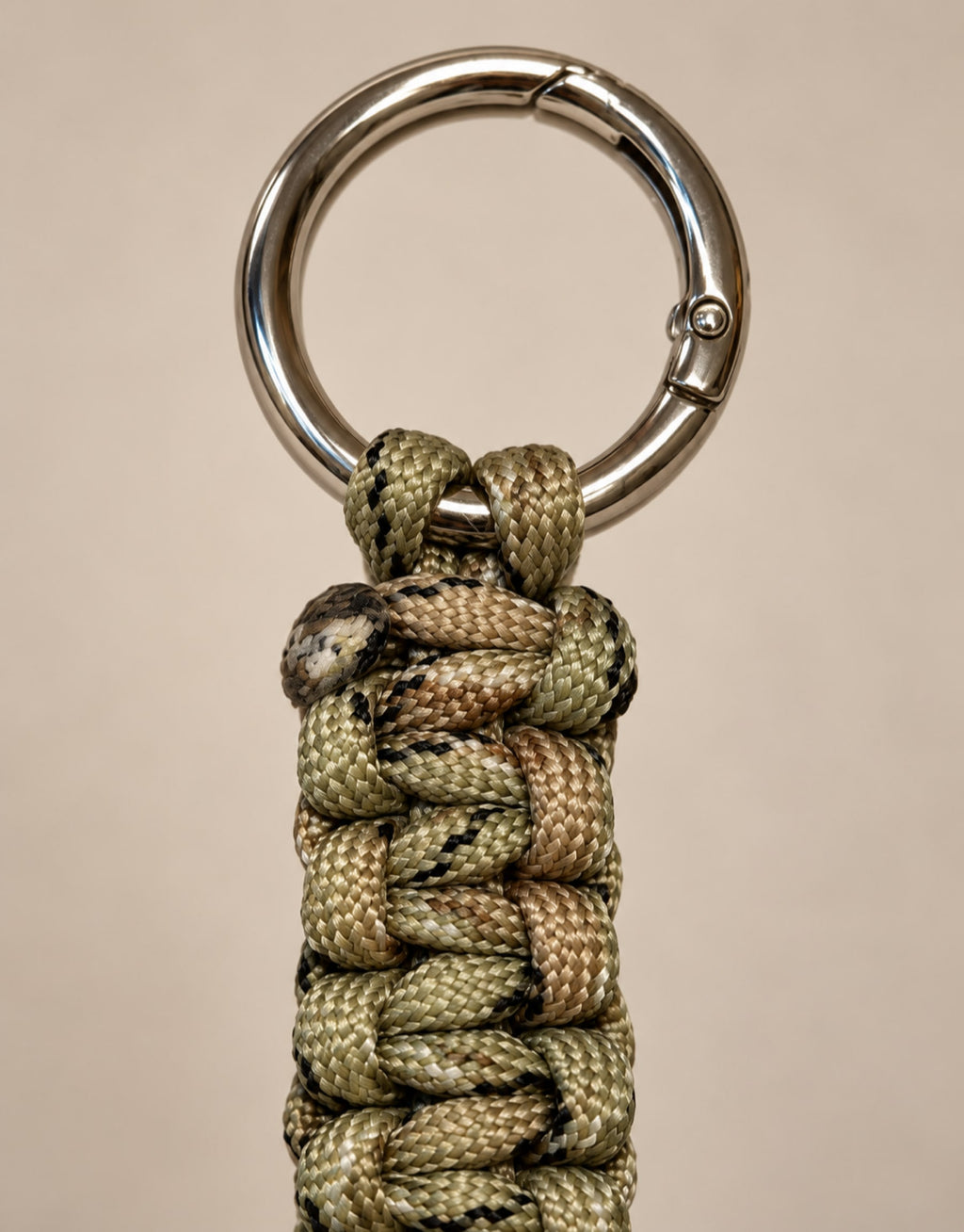 Steel clasp ring on the Naag camo paracord keychain