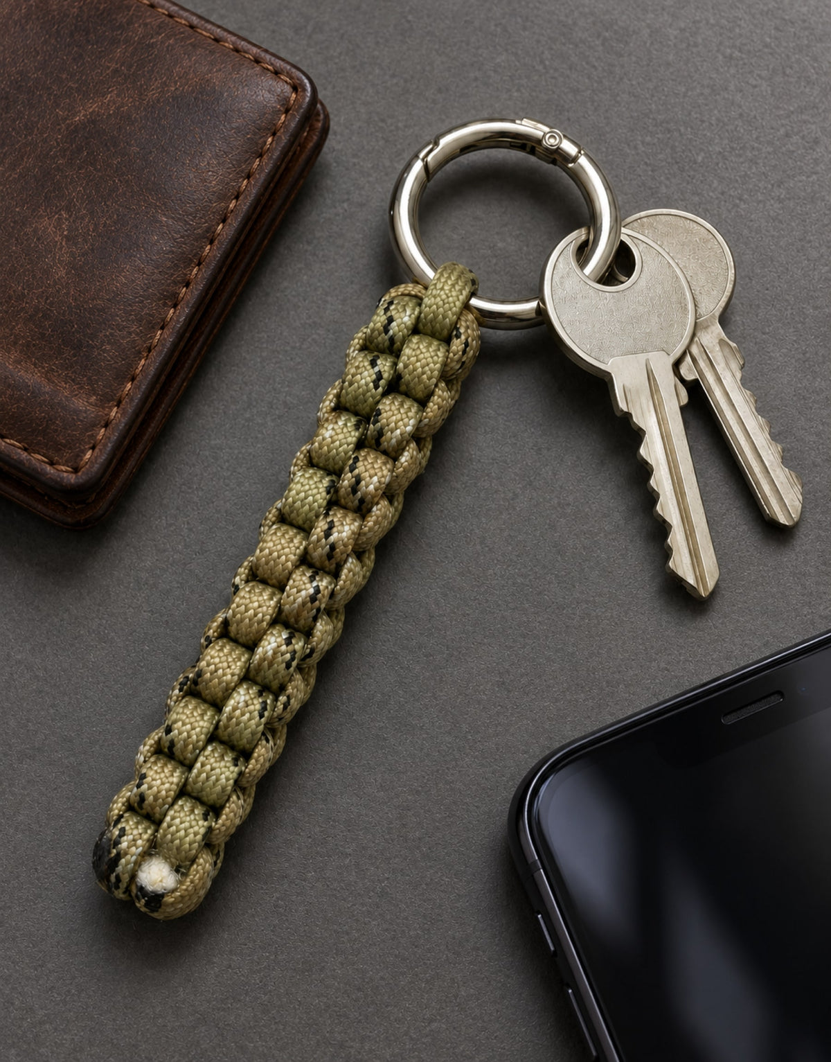 Saf camo paracord keychain in an everyday carry flat lay