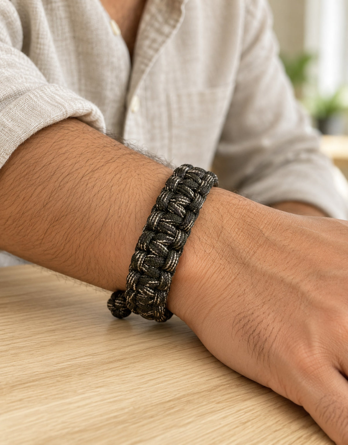 Sipahi dark camo paracord bracelet worn on the wrist
