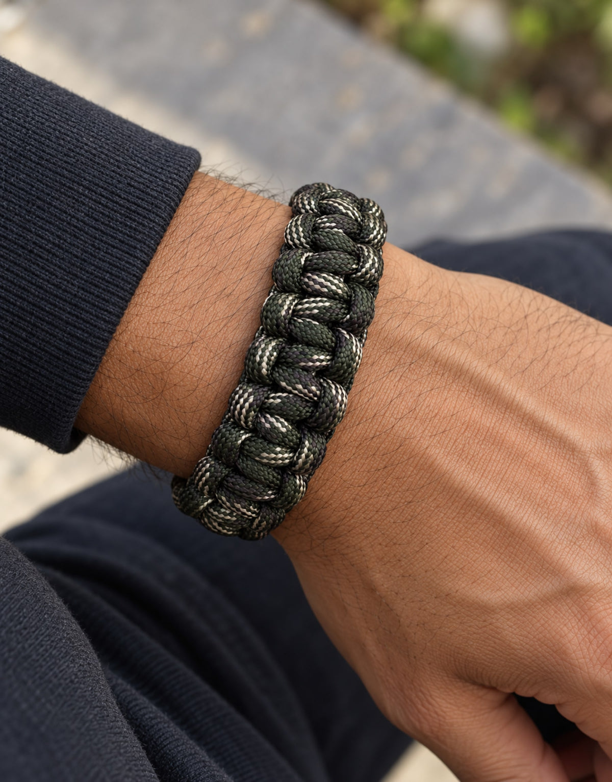 Close-up of the Sipahi camo paracord bracelet on a man's wrist