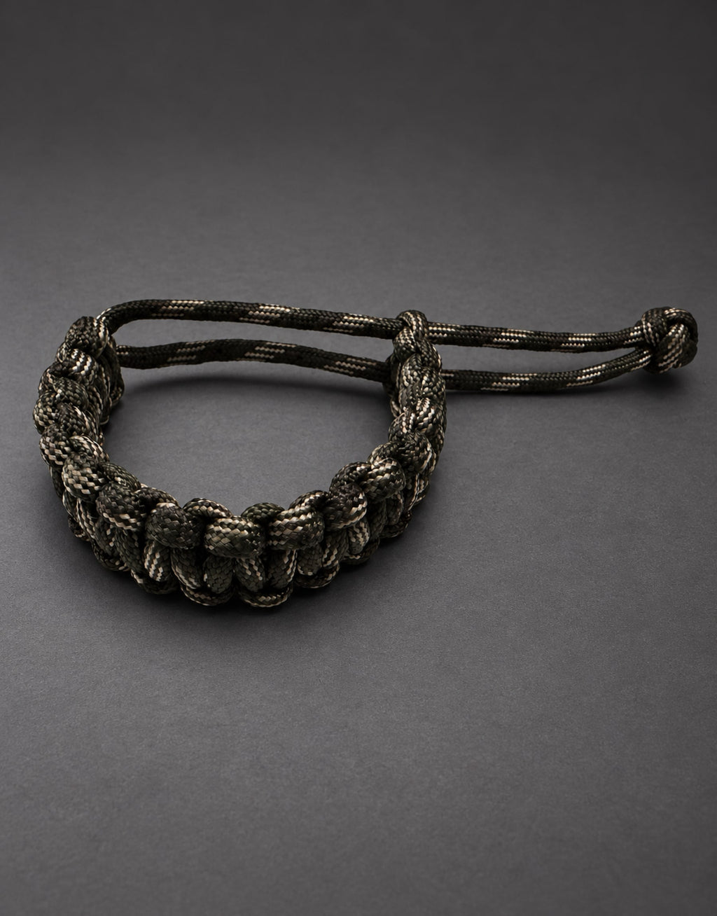 Sipahi dark camo paracord bracelet in a dark studio