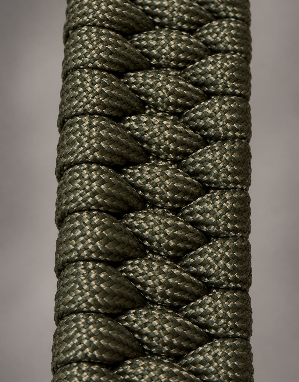 Macro of the triple cobra weave on the Zirah dark green paracord bracelet