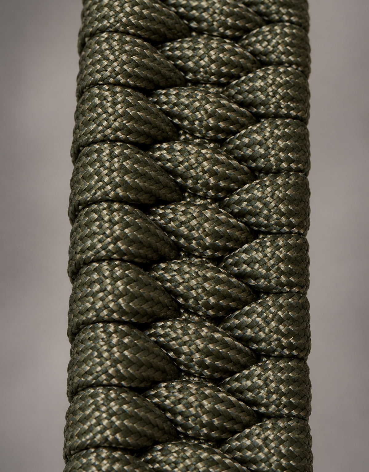 Macro of the triple cobra weave on the Zirah dark green paracord bracelet