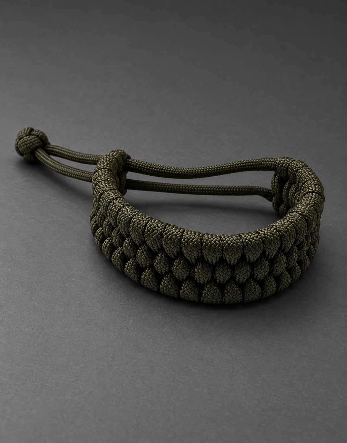 Zirah dark green triple paracord bracelet in a dark studio